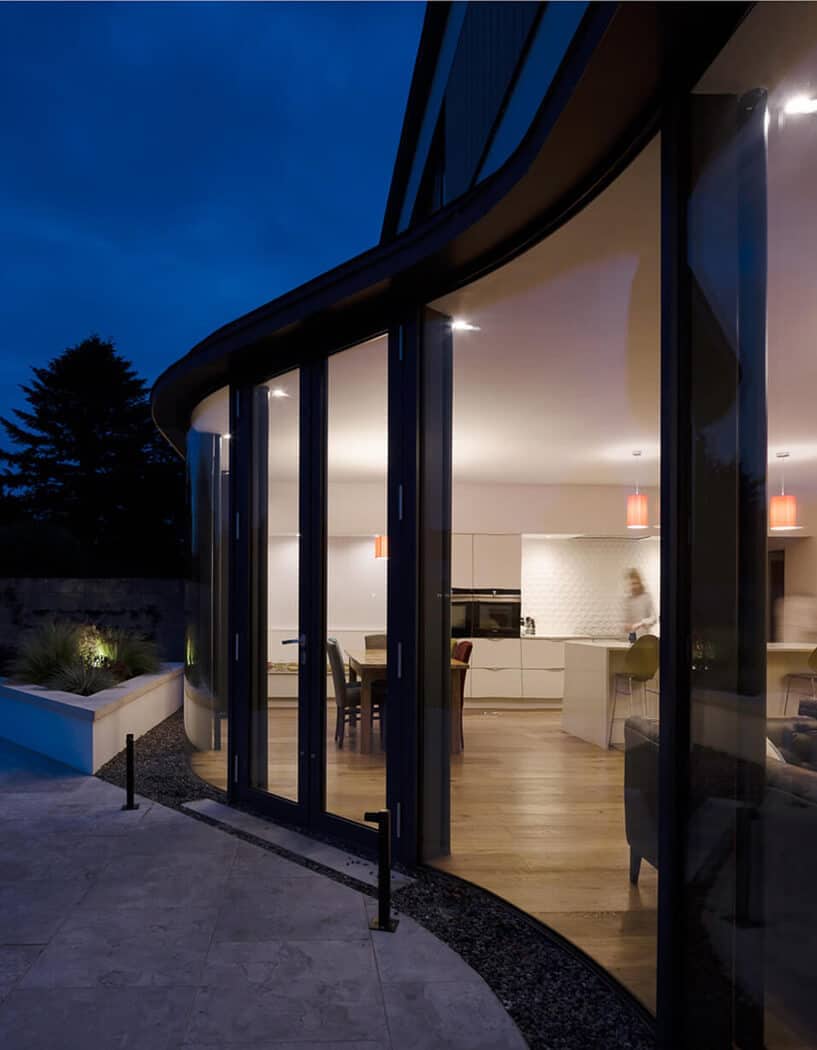 Curved glazed screen at night