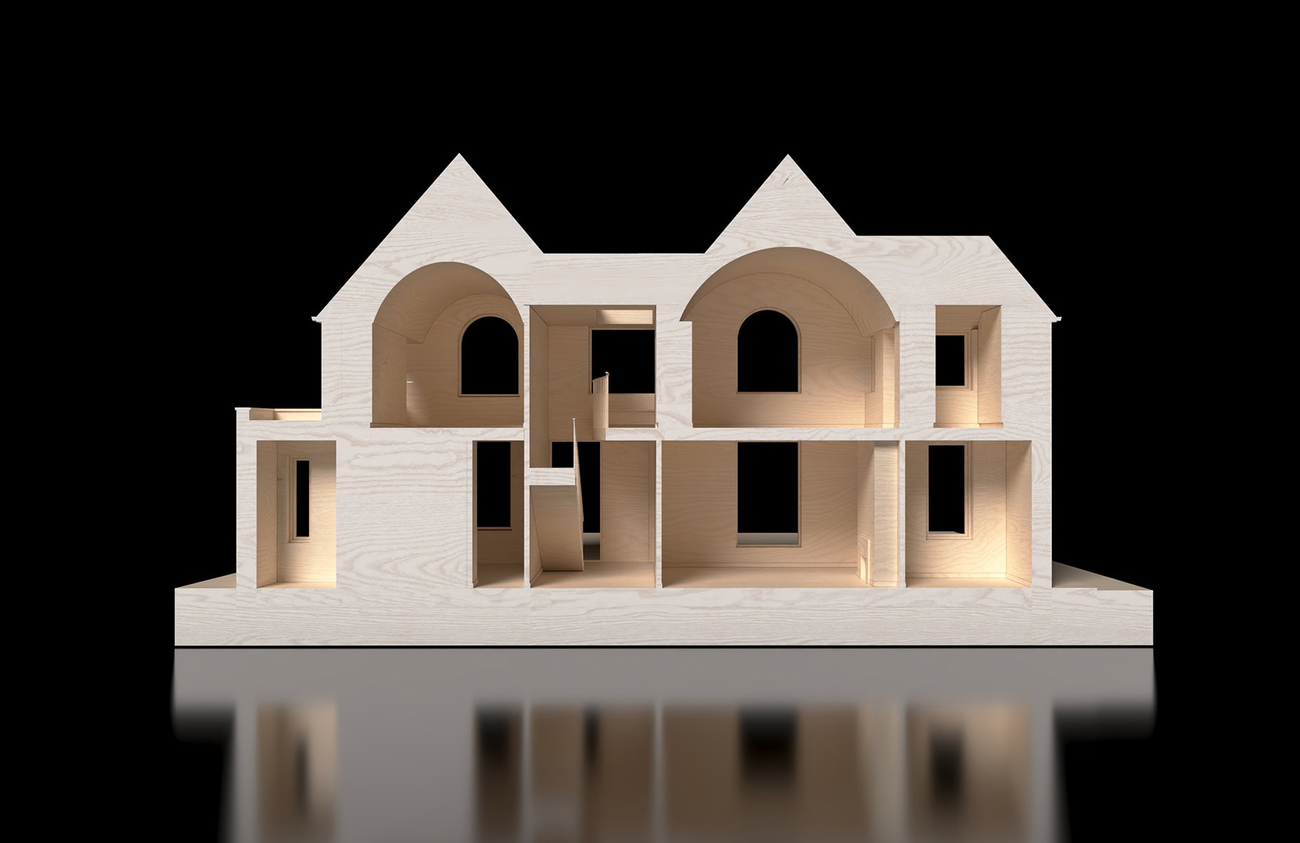 A sectional model offering insight into the spatial planning, with vaulted ceilings and the dramatic central hall on full display.