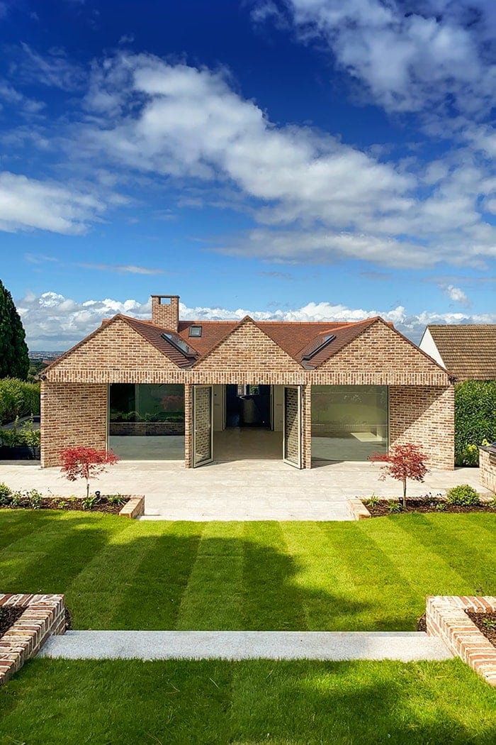 Architect-designed brick gable house in Dublin with a clear blue sky