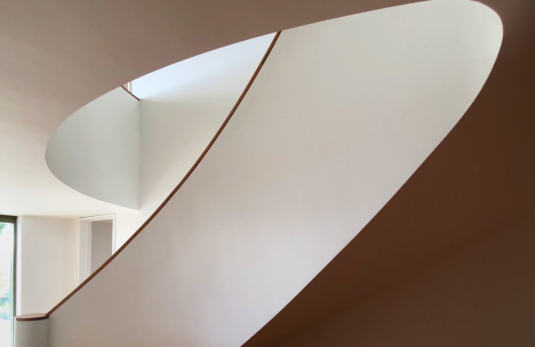 Curved staircase in a Dublin home showcasing architectural excellence