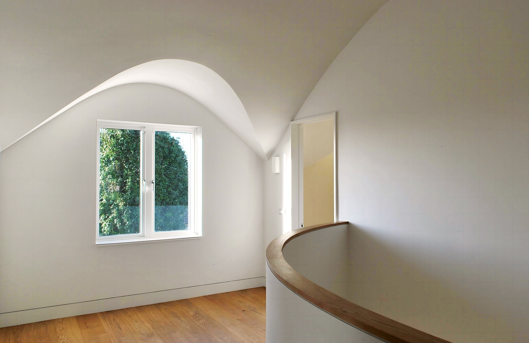Bright interior with white curves designed by Dublin architects