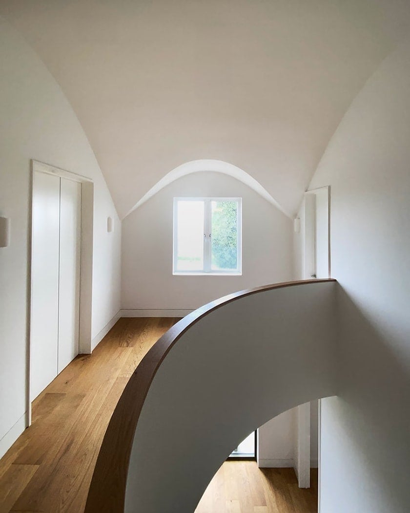 Double-height stair hall in Dublin home, created by local architects