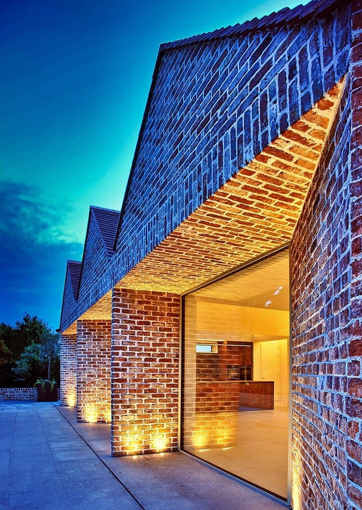 Dusk view of a garden elevation by Dublin residential architects