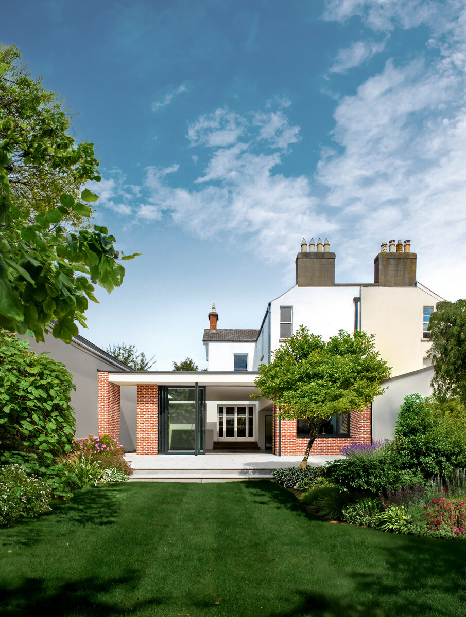 The new extension includes brick piers which are sympathetic to the character of the original house