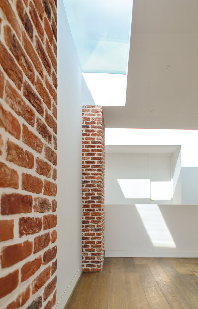 A detail of the brick piers under the rooflights