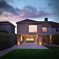 Night view of contemporary brick extension to rear of Glenageary semi-d by Dublin Architects