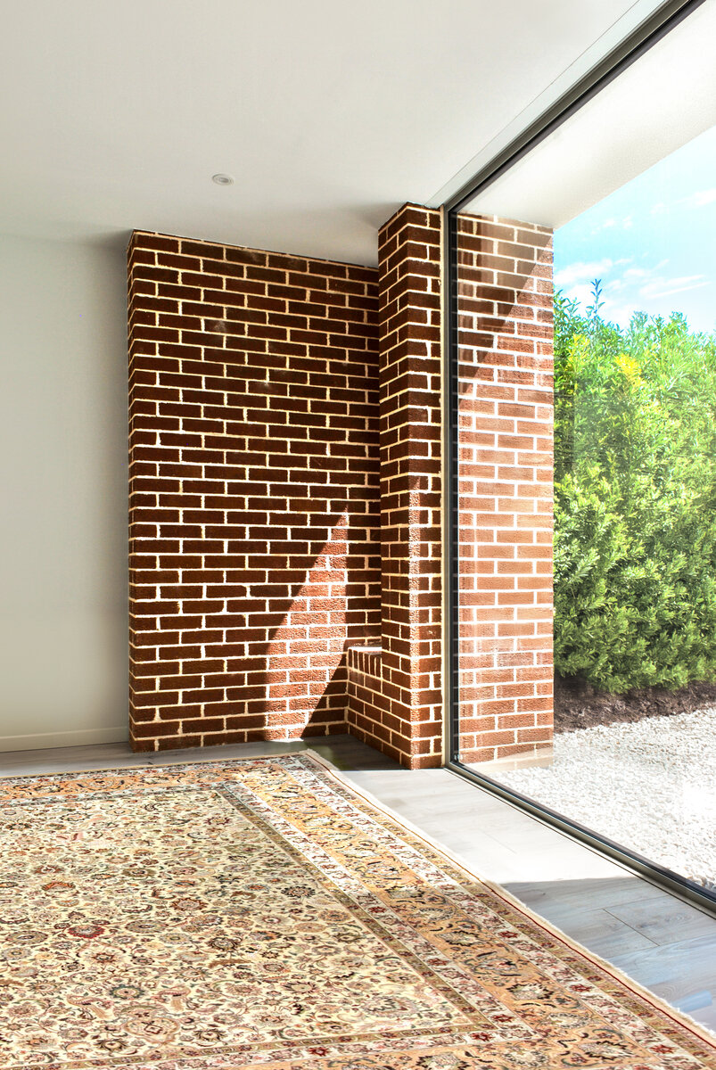 Brick piers with sunlight streaming in through window