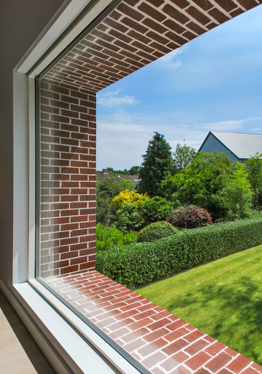 View through Master Bedroom picture window to garden