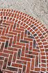 Basket weave brickwork inlaid within semi-circular steps leading to the hall door.