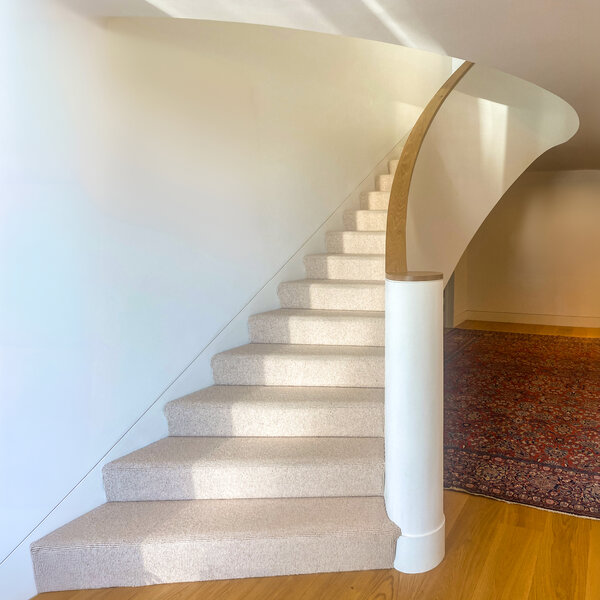 Dramatic curved staircase in newbuild South Dublin house