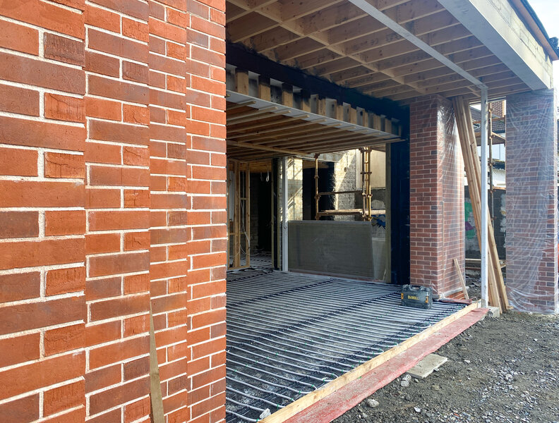 Brick piers and underfloor pipes on Callary Road�a cool morning, but the future of this rebuild is looking warm and bright