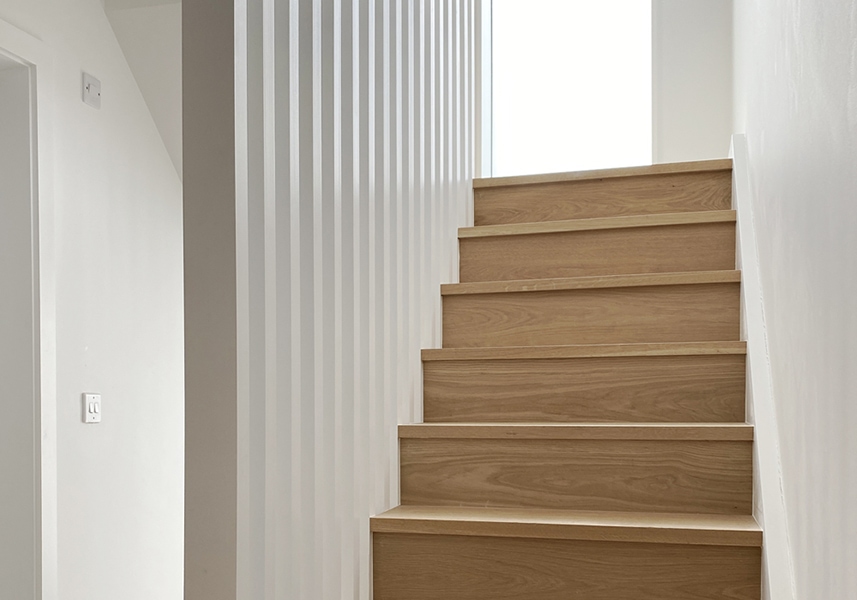 A three-storey house is reorganised around a new staircase in a completely new position. 